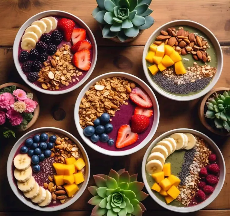 A colorful assortment of smoothie bowls with fresh fruit and toppings.