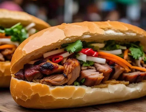 A freshly made Vietnamese banh mi sandwich with crispy baguette, grilled pork, pickled vegetables, and cilantro.