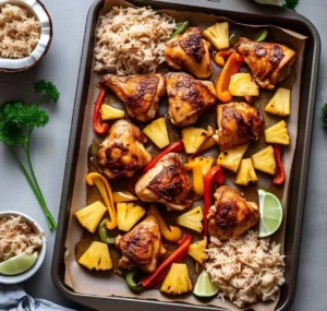 A vibrant Hawaiian Chicken Sheet Pan meal with pineapple, bell peppers, and chicken on a baking tray.